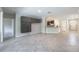 Expansive living room featuring tile floors and an open layout, perfect for entertaining and relaxation at 9860 Smarty Jones Dr, Ruskin, FL 33573