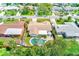 Aerial view of a home showcasing a backyard with a pool and patio area at 11082 90Th Ter, Seminole, FL 33772