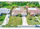 Aerial view of home with fenced yard and pool surrounded by lush landscaping at 11082 90Th Ter, Seminole, FL 33772