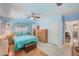 Bedroom with blue accents and an ensuite bathroom at 11082 90Th Ter, Seminole, FL 33772