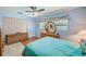 Bright bedroom featuring a ceiling fan and natural light at 11082 90Th Ter, Seminole, FL 33772