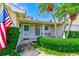 Inviting front porch with tropical landscaping at 11082 90Th Ter, Seminole, FL 33772