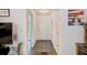 Entryway with neutral walls and flooring, and a view of the bright interior at 11082 90Th Ter, Seminole, FL 33772