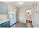 Charming eat-in kitchen features blue cabinetry and a view to the hallway at 11082 90Th Ter, Seminole, FL 33772