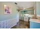 Open kitchen with blue cabinets, white appliances, ceiling fan and ample counter space at 11082 90Th Ter, Seminole, FL 33772