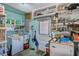 Functional laundry room with a washer, dryer, and storage shelves at 11082 90Th Ter, Seminole, FL 33772