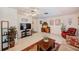 Bright living room features tile floors, ceiling fan and comfortable furnishings at 11082 90Th Ter, Seminole, FL 33772