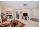 Bright living room featuring tile floors, a ceiling fan, and a view of the doorway to the entryway at 11082 90Th Ter, Seminole, FL 33772