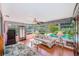 Enclosed sunroom features bright, airy space and views of the pool and backyard at 11082 90Th Ter, Seminole, FL 33772