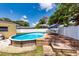Sparkling above ground pool with deck in the landscaped backyard at 11398 88Th Ave, Seminole, FL 33772