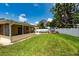 Spacious backyard with above ground pool, deck, and enclosed patio at 11398 88Th Ave, Seminole, FL 33772