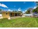 Beautifully landscaped backyard with enclosed patio and above-ground pool at 11398 88Th Ave, Seminole, FL 33772