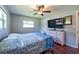 Spacious bedroom featuring wood-look floors and a ceiling fan at 11398 88Th Ave, Seminole, FL 33772