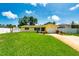 Charming single-story home with a well-manicured lawn and driveway at 11398 88Th Ave, Seminole, FL 33772