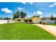 Charming single-story home with a well-manicured lawn and driveway at 11398 88Th Ave, Seminole, FL 33772