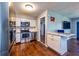 Updated kitchen featuring stainless steel appliances, breakfast bar and wood-look floors at 11398 88Th Ave, Seminole, FL 33772