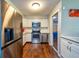 Updated kitchen with stainless steel appliances, white cabinets, and wood floors at 11398 88Th Ave, Seminole, FL 33772