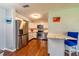 Bright kitchen features stainless steel appliances, white cabinetry, and wood-look floors at 11398 88Th Ave, Seminole, FL 33772