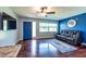 Bright living room with a blue door and modern decor, offering a cozy and stylish atmosphere at 11398 88Th Ave, Seminole, FL 33772