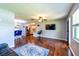 Open living area with dining space and kitchen views, with hardwood floors and modern lighting at 11398 88Th Ave, Seminole, FL 33772