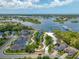 Community aerial showcasing waterfront living with private docks, boat storage, and picturesque views of the bay at 1242 Windy Bay Shl, Tarpon Springs, FL 34689