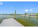 The well-kept community boat dock shows the opportunity for boaters and water enthusiasts alike at 1242 Windy Bay Shl, Tarpon Springs, FL 34689