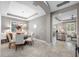 Dining room with a modern chandelier, adjacent to a spacious living area with comfortable seating at 1242 Windy Bay Shl, Tarpon Springs, FL 34689
