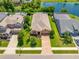 Inviting home exterior shows manicured landscaping, a brick driveway, and a well-maintained yard, offering curb appeal at 1242 Windy Bay Shl, Tarpon Springs, FL 34689