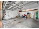 Clean two-car garage features storage, utility sink, and room for vehicles at 1242 Windy Bay Shl, Tarpon Springs, FL 34689