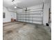 Spacious two-car garage featuring an automatic door and plenty of room for storage at 1242 Windy Bay Shl, Tarpon Springs, FL 34689