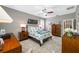 Comfortable main bedroom featuring a ceiling fan and neutral tones, creating a relaxing atmosphere at 1242 Windy Bay Shl, Tarpon Springs, FL 34689