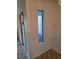 Inviting entryway featuring a side window at 1281 Pine Ridge E Cir # B1, Tarpon Springs, FL 34688