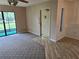Comfortable living room with sliding glass doors and a welcoming entryway at 1281 Pine Ridge E Cir # B1, Tarpon Springs, FL 34688