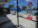 Community pool area with security and rules posted at 1281 Pine Ridge E Cir # B1, Tarpon Springs, FL 34688