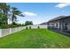 Spacious fenced backyard with well maintained lawn and a screened lanai at 12835 Wildflower Meadow Dr, Riverview, FL 33579