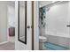 Bathroom featuring tub and shower with a view into the hallway at 12835 Wildflower Meadow Dr, Riverview, FL 33579
