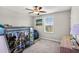 Bedroom with a ceiling fan, a bunk bed and a dresser at 12835 Wildflower Meadow Dr, Riverview, FL 33579