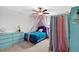 Bedroom with a canopy bed, a ceiling fan and a blue dresser at 12835 Wildflower Meadow Dr, Riverview, FL 33579