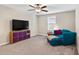 A cozy bonus room offers a comfortable seating area, perfect for relaxation and entertainment at 12835 Wildflower Meadow Dr, Riverview, FL 33579