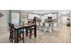 Open-concept kitchen features a dining area with a view and modern finishes throughout at 12835 Wildflower Meadow Dr, Riverview, FL 33579