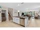Kitchen features an island with a sink, stainless steel dishwasher and an open-concept design at 12835 Wildflower Meadow Dr, Riverview, FL 33579