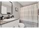 Modern bathroom featuring a granite countertop vanity and a shower-tub combo at 13111 Fruitville Way, Riverview, FL 33579