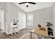 Bedroom with a fan, a desk, a vanity, and a window allowing natural light at 13111 Fruitville Way, Riverview, FL 33579