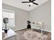 Bedroom with a fan, a vanity, a rug, and a window allowing natural light at 13111 Fruitville Way, Riverview, FL 33579