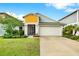 Charming single-Gathering home featuring a well-manicured lawn and two-car garage at 13111 Fruitville Way, Riverview, FL 33579