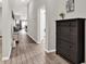 Inviting hallway with stylish wood-look flooring and contemporary decor at 13111 Fruitville Way, Riverview, FL 33579