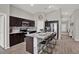 Modern kitchen featuring stainless steel appliances and large island with bar stool seating at 13111 Fruitville Way, Riverview, FL 33579