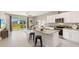 Spacious kitchen featuring stainless steel appliances, granite countertops, and modern cabinetry at 133 Mangrove Shade Cir, Apollo Beach, FL 33572