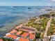 An aerial view of waterfront condos near the city with access to the beach, boat docks and fishing piers at 1340 Bayshore Blvd # 502, Dunedin, FL 34698
