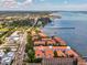 An aerial view showing waterfront condos with easy access to the beach, boat docks, and stunning coastal views at 1340 Bayshore Blvd # 502, Dunedin, FL 34698